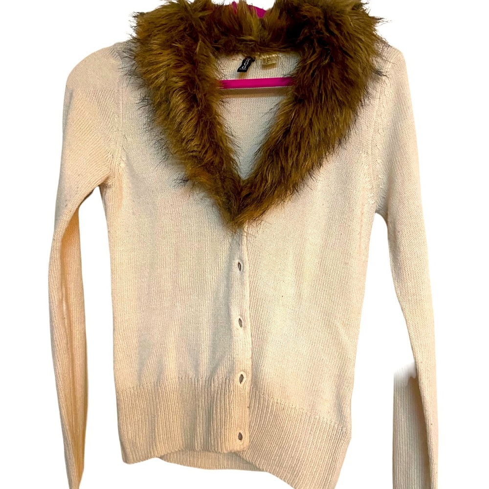 Divided cardigan with removable faux fur collar.